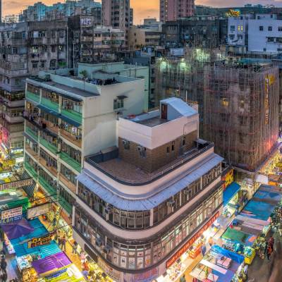 a city street filled with lots of tall buildings