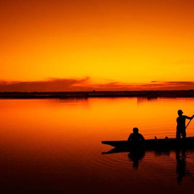 a sunset over a body of water