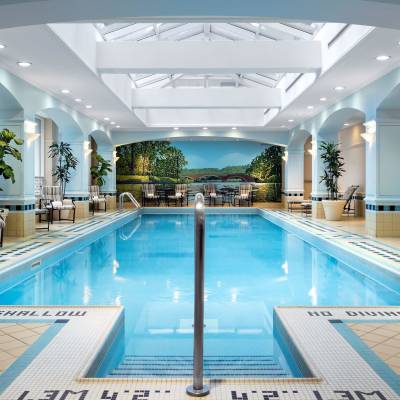 a room with a pool in front of a building