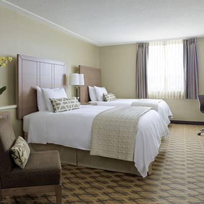 a bedroom with a large bed in a hotel room