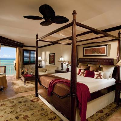 a bedroom with a large bed in a hotel room