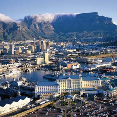 a harbor filled with water and a mountain in the background