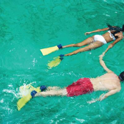 a person swimming in a pool of water