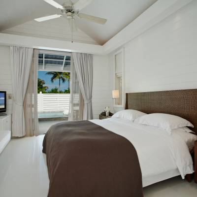 a bedroom with a large bed in a hotel room