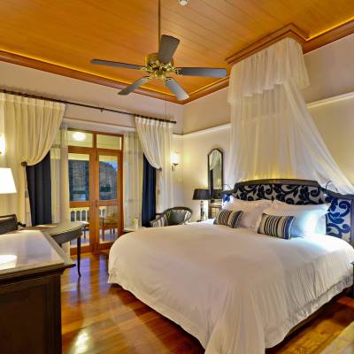 a bedroom with a large bed in a room