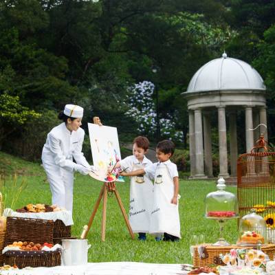 a group of people sitting at a picnic table