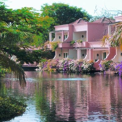 a small house surrounded by water