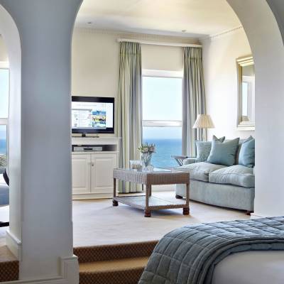 a living room filled with furniture and a large window