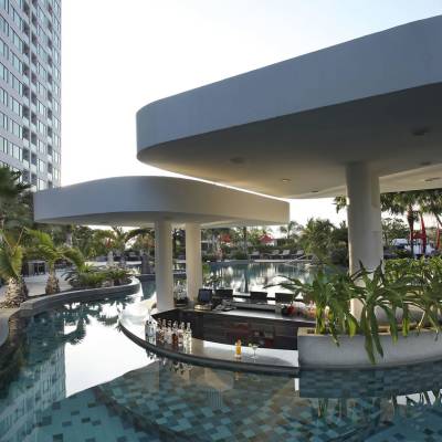 a large building with a pool