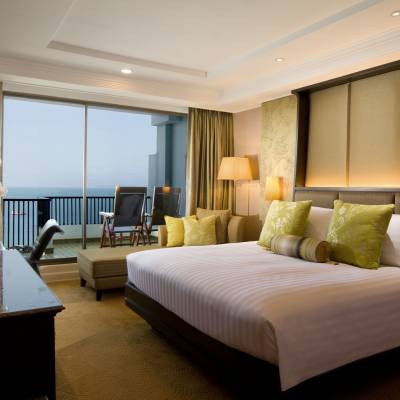 a bedroom with a large bed in a hotel room