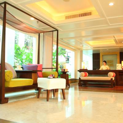 a living room filled with furniture and a large window
