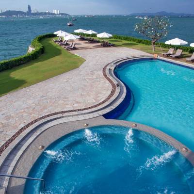 a pool next to a body of water