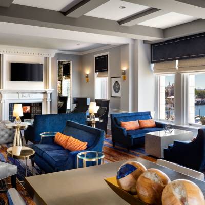 a living room filled with furniture and a large window