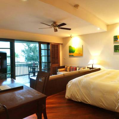 a bedroom with a view of a living room