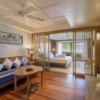 a living room filled with furniture and a large window
