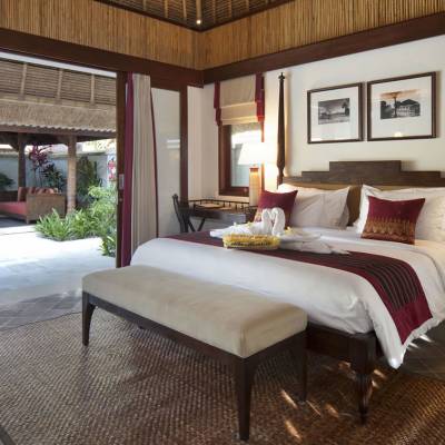 a bedroom with a large bed in a hotel room