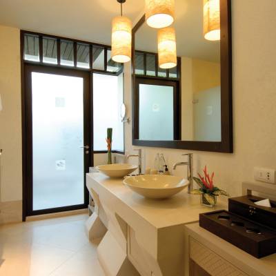 a room with a sink and a mirror