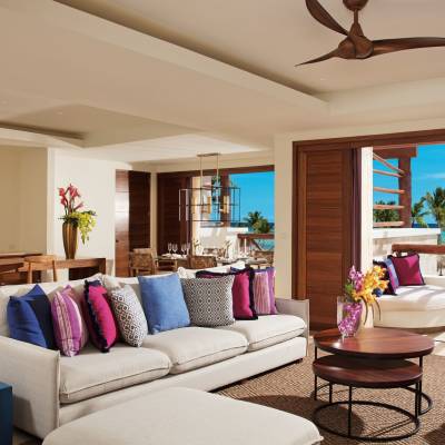 a living room filled with furniture and a large window