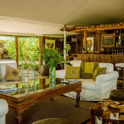 a living room filled with furniture and a large window