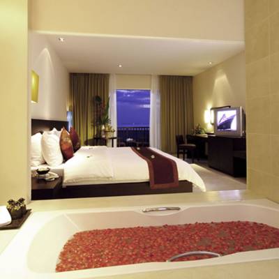 a bedroom with a large mirror