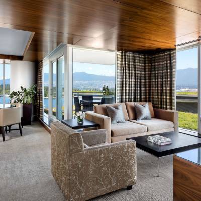 a view of a living room filled with furniture and a large window