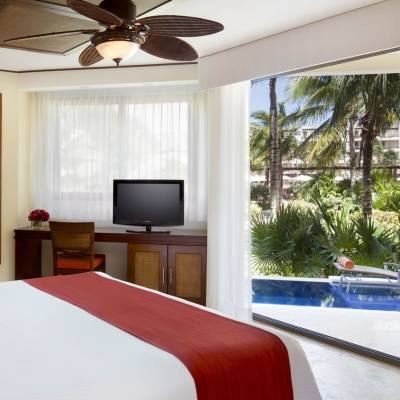 a hotel room with a bed and a window