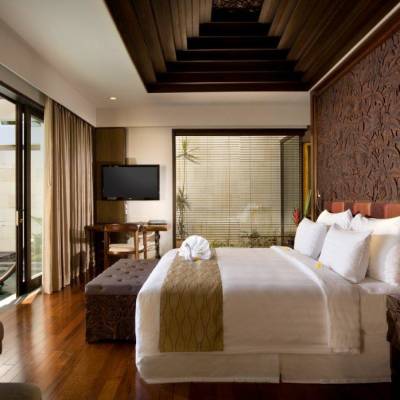 a bedroom with a large bed in a room
