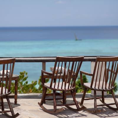 a wooden bench sitting next to a body of water