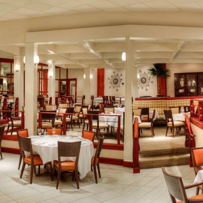 a living room filled with furniture and a large window