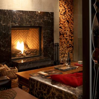 a fire place sitting in a living room with a fireplace