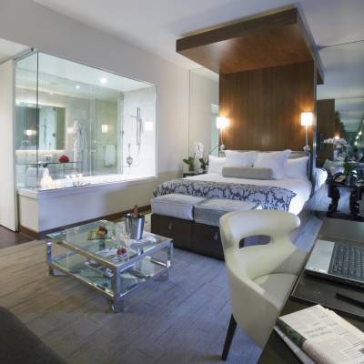 a room filled with furniture and a large window