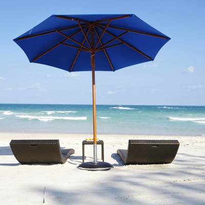 an umbrella sitting on top of a beach