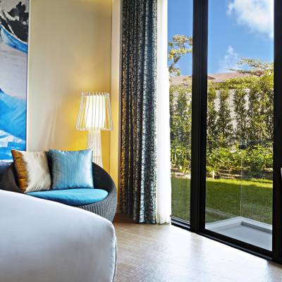 a view of a living room with a bed and a window