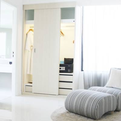 a bedroom with a bed in a room