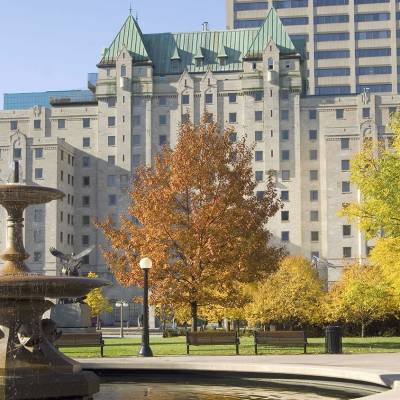 a tall building in a city park