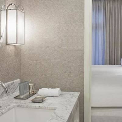 a bedroom with a large mirror