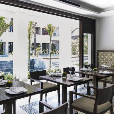 a dining room table in front of a window