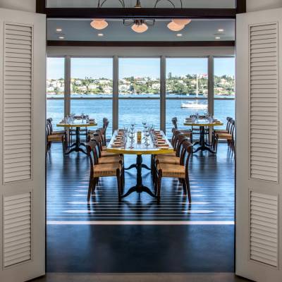 a dining room table in front of a window