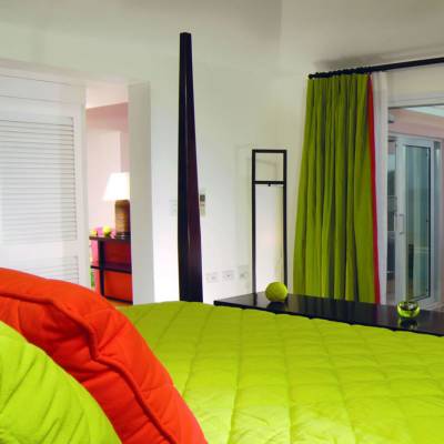 a bedroom with a bed in a room