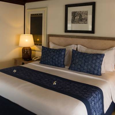 a living room filled with furniture and a bed