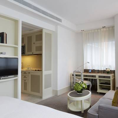 a living room filled with furniture and a large window