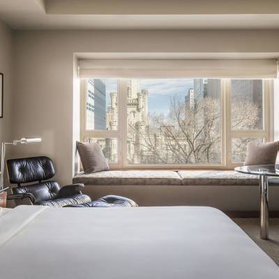 a bedroom with a large bed in a hotel room