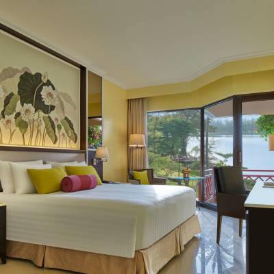 a bedroom with a large bed in a room