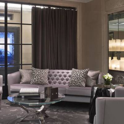 a living room filled with furniture and a large window