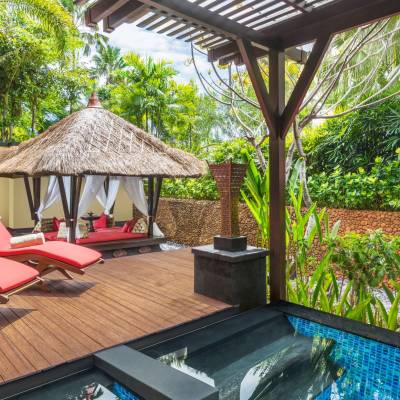 a chair sitting in front of a building