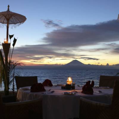 an umbrella sitting on top of a body of water