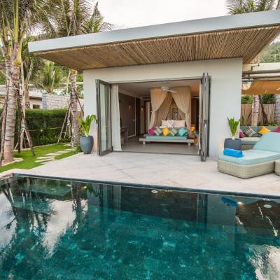 a person in a pool of water in front of a house