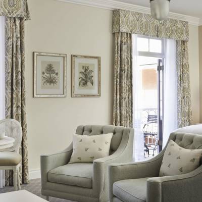 a living room filled with furniture and a large window