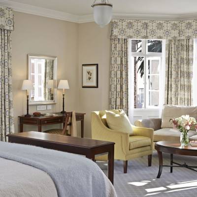 a living room filled with furniture and a large window