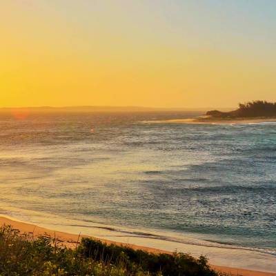 a sunset over a body of water